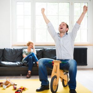 family dad is rediscovering the child within. this photo was taken during the "berlin istockalypse" photo event in june 2012.