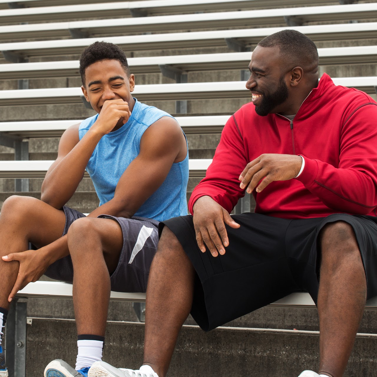 Mentor and role model laughing and spending with the youth.