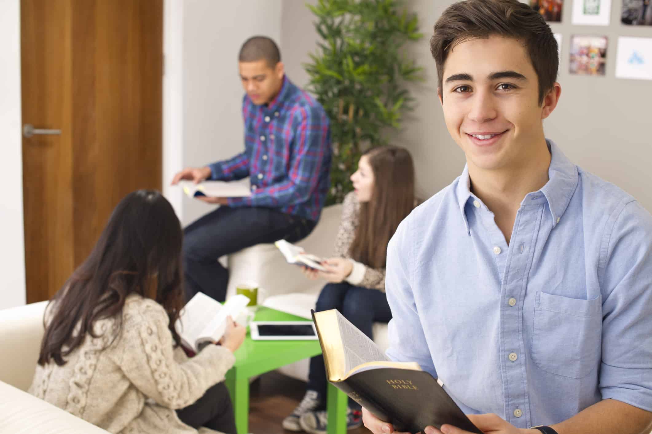 youngsters chatting working on their bible studies